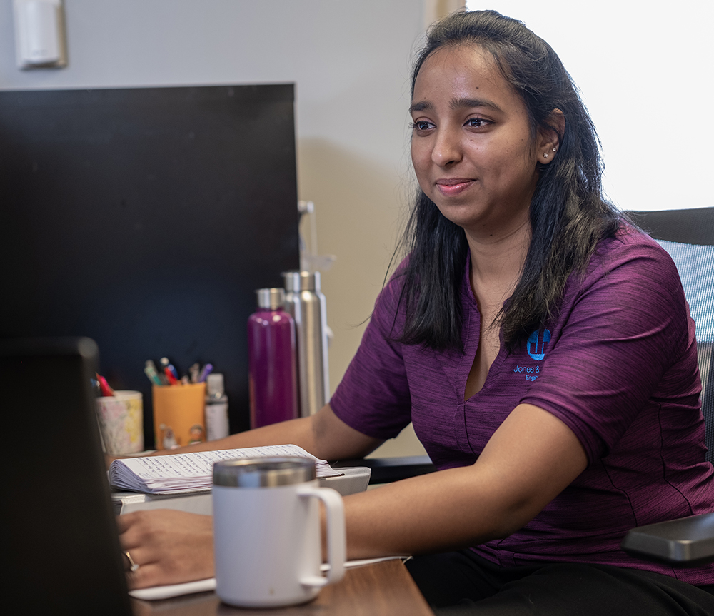 Jones & Henry employee working at her desk