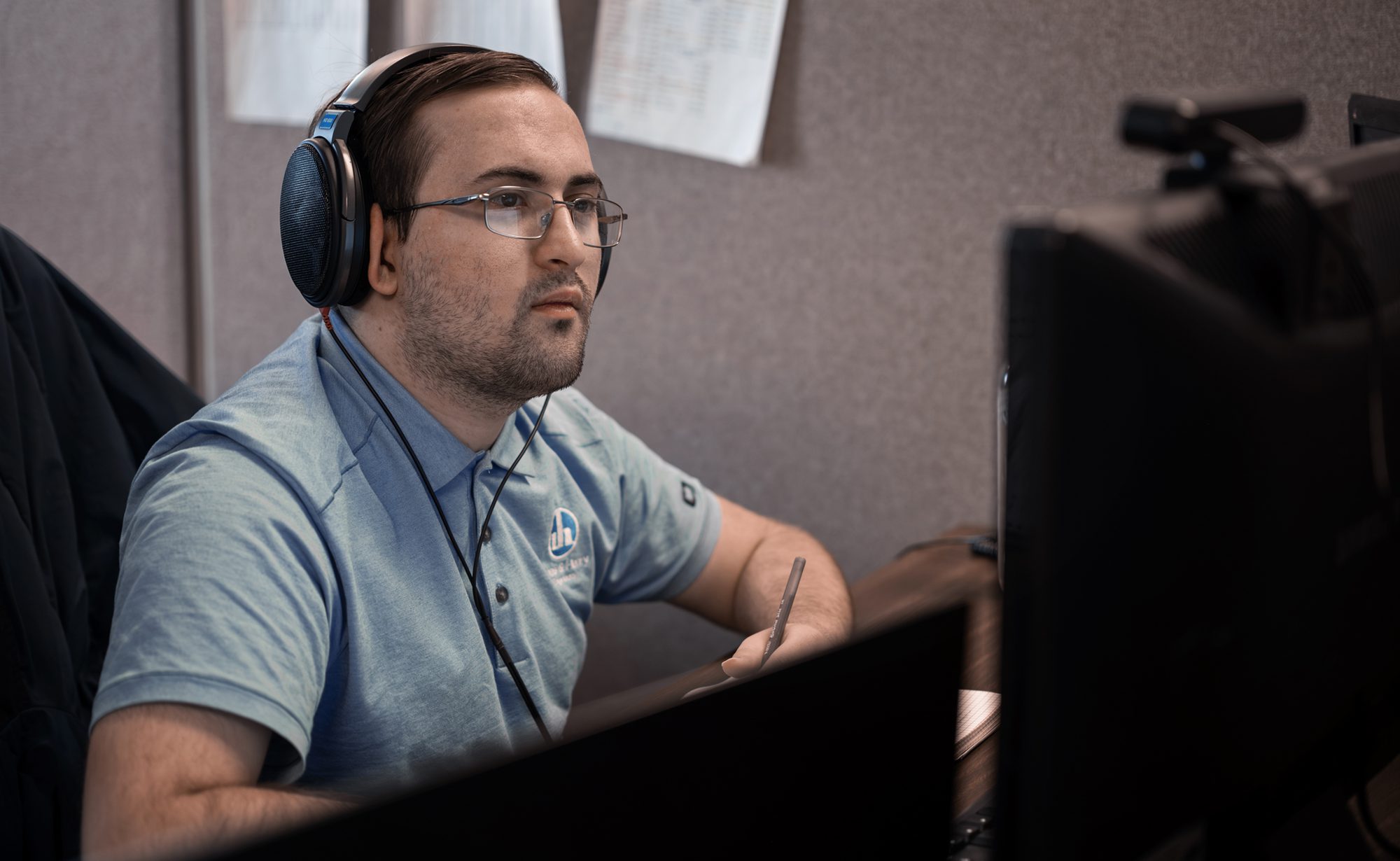 Worker at desk looking at computer