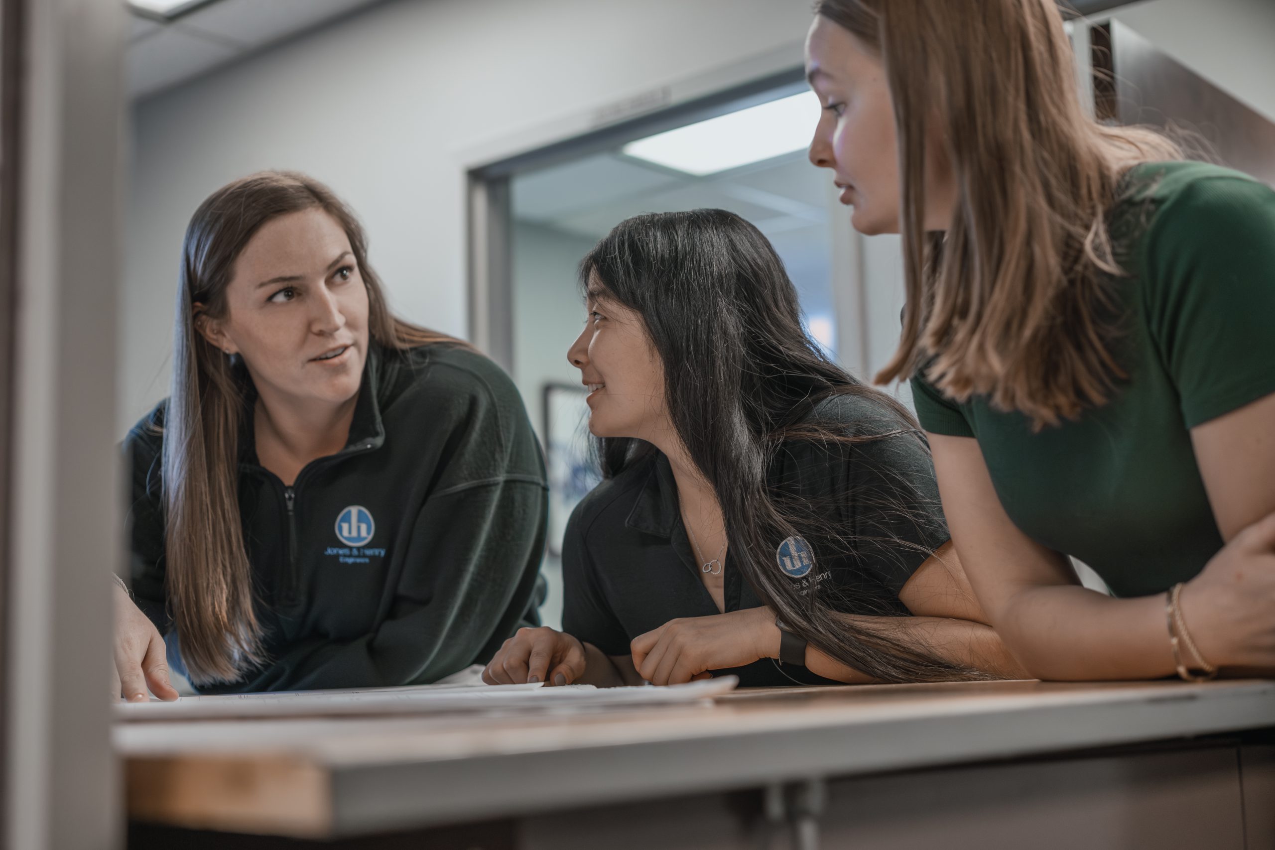 Three team members discussing project