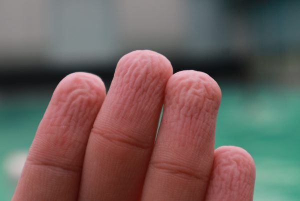 Finger wrinkled from time in the water